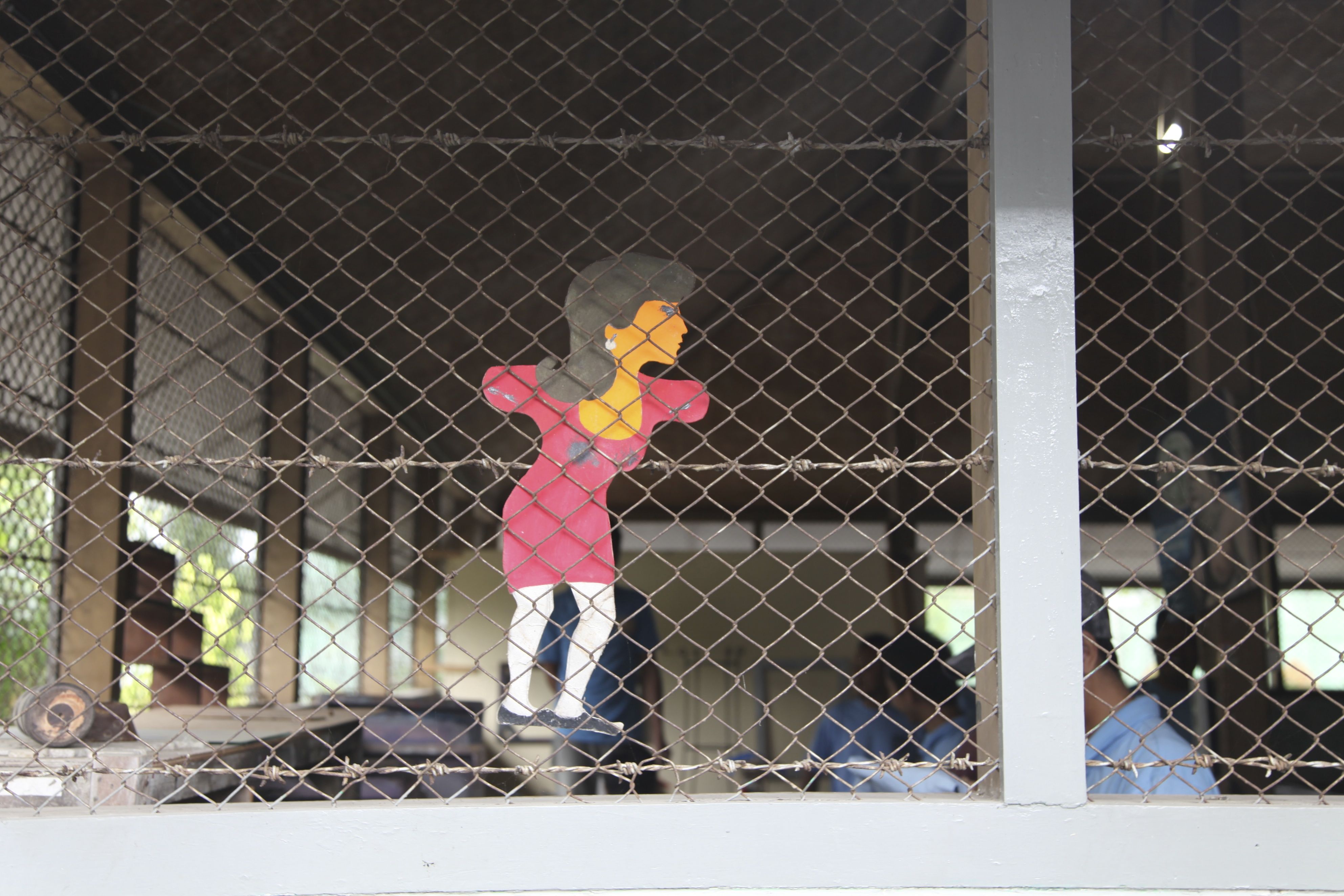 Caption: A stencil of a woman adorns the men’s workshop at Wirogunan prison, reminding inmates of the outside world - Nikki Edwards Incarceration in Indonesia